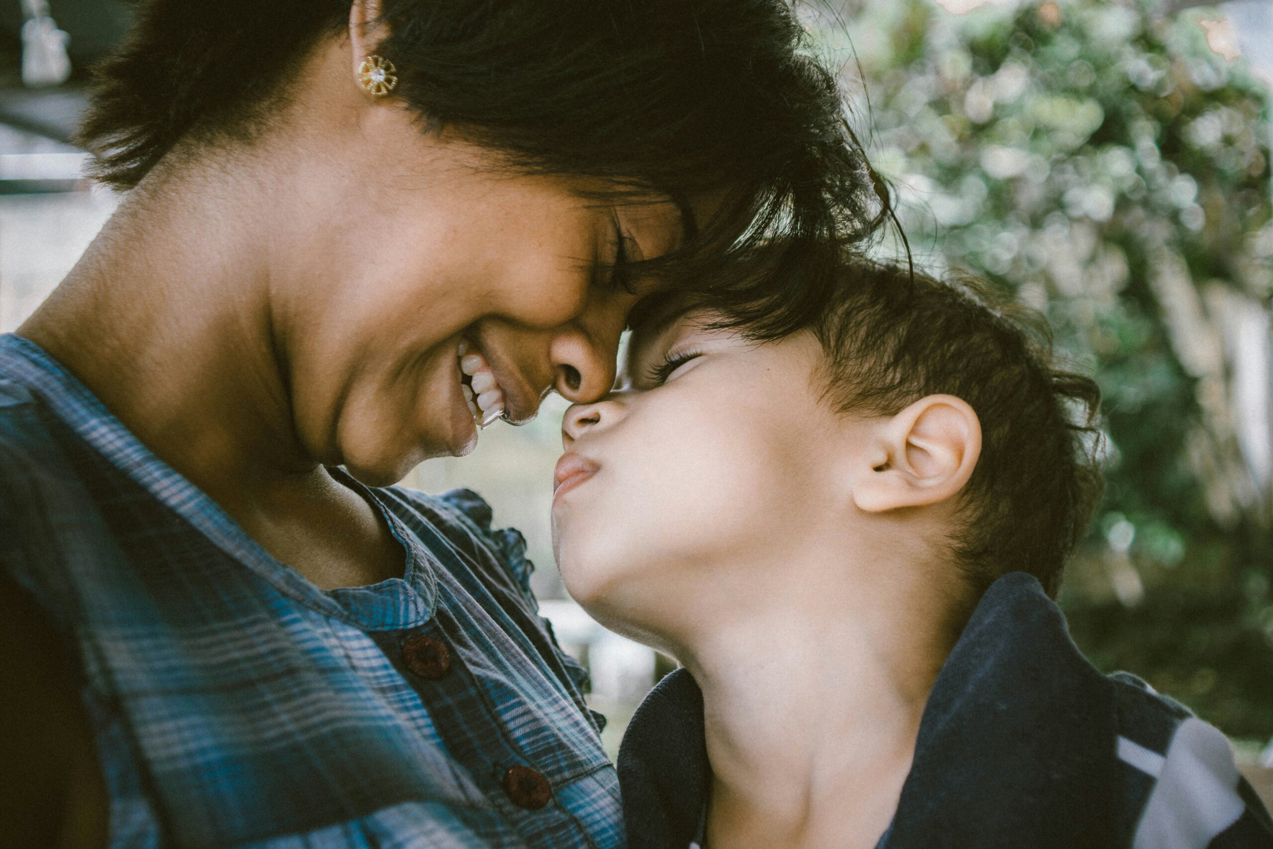 Parent holding child, representing compassionate support for parents of children with disabilities in Austin, TX