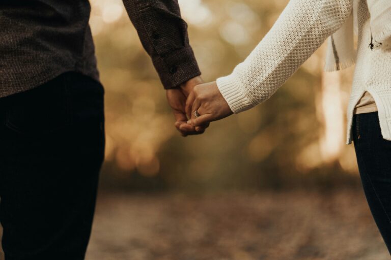 Couple holding hands, symbolizing connection and relationship healing through couples therapy in Austin, TX